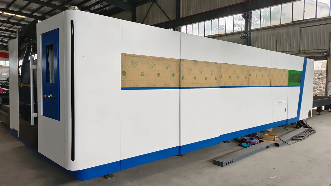AC380V/50Hz/60Hz Power Supply Exchange Table Laser Cutting Machine with Enclosed Protective Cover 3000W Laser Power Mesin pemotong laser dengan tutup pelindung tertutup 0